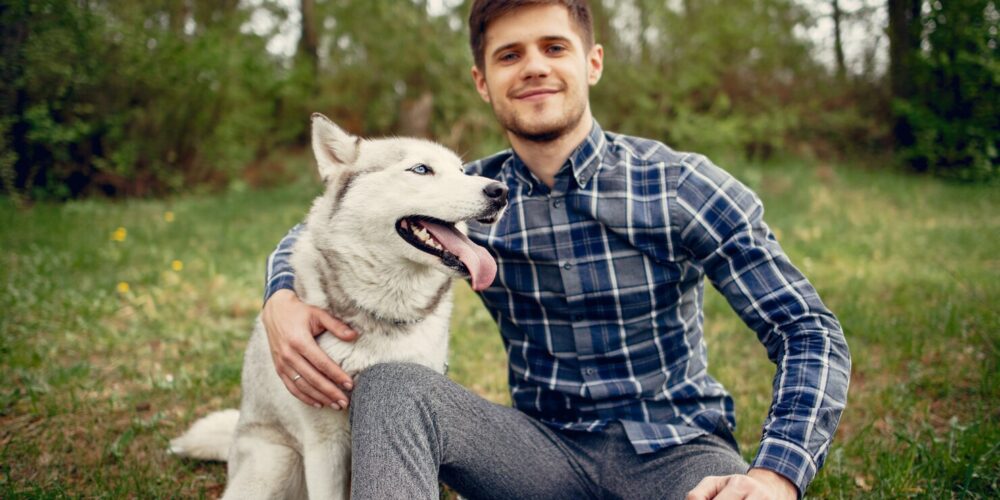 handsome-guy-summer-park-with-dog_1157-22840