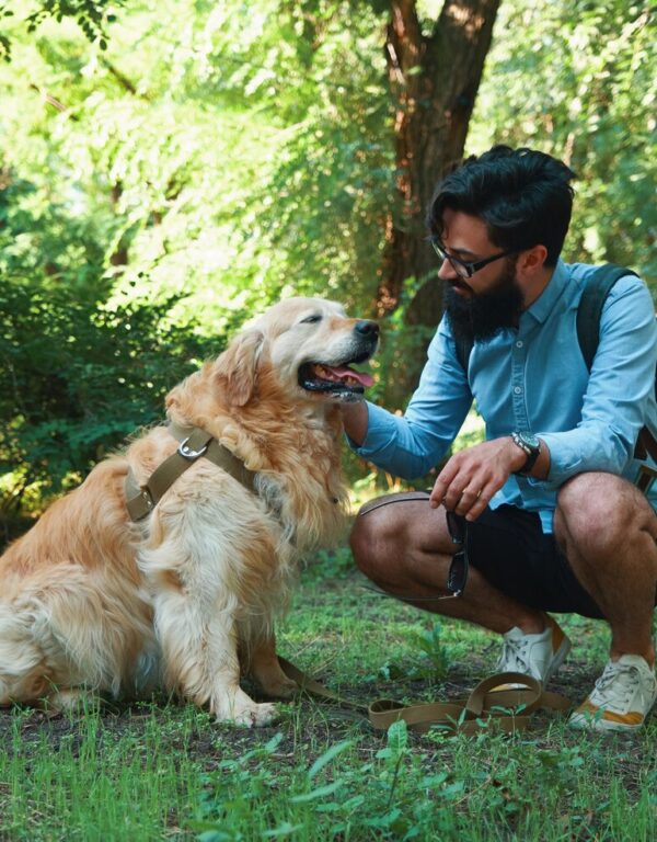 handsome-young-man-with-golden-retriver-outdoors_158595-4257